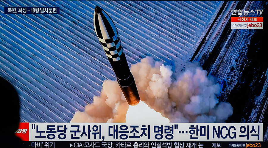 A TV at Yongsan Railway Station in Seoul shows a Hwasong-18 solid-fuel intercontinental ballistic missile that was launched by North Korea on Dec. 18. It is among the recent provocative acts that are fueling tensions on the Korean peninsula. (Photo by KIM Jae-Hwan/SOPA Images/LightRocket via Getty Images)