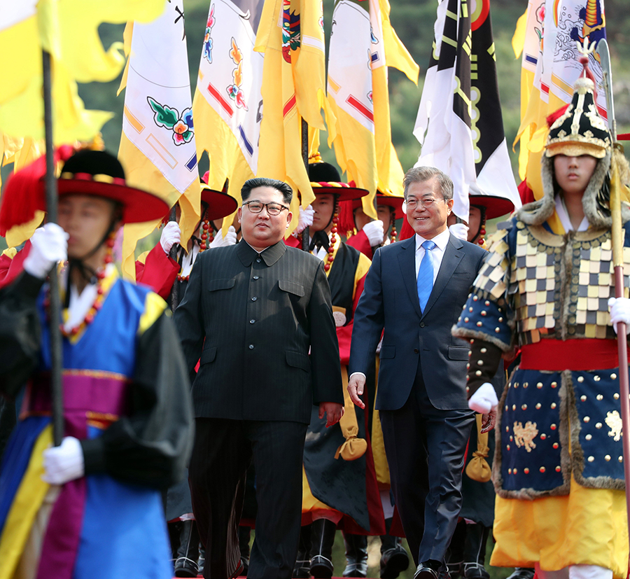 In April 2018, South Korean President Moon Jae-in (R) and North Korean leader Kim Jong Un (L) were all smiles during the welcoming ceremony that was part of their meeting on the South Korean side of the demilitarized zone. Since then, Kim has designated the South as the North’s principal enemy. (Photo by Inter-Korean Summit Press Corps / Pool/Anadolu Agency/Getty Images)