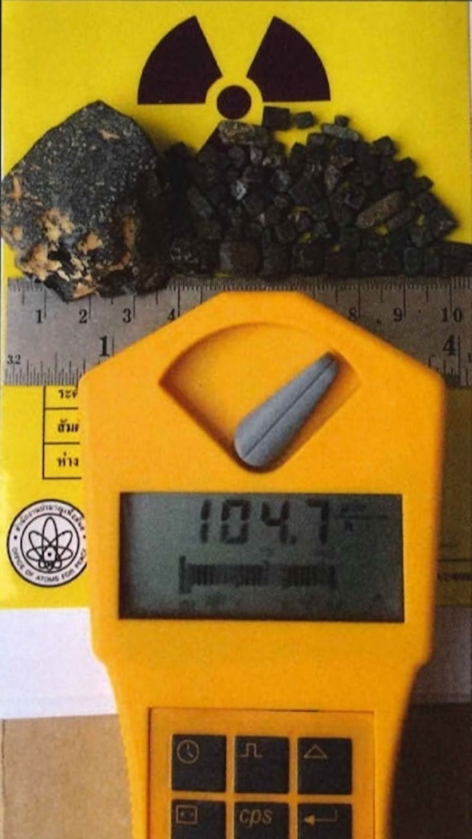 Takeshi Ebisawa, charged by the U.S. Justice Department with trafficking nuclear materials, sent photos of substances next to Geiger counters that measured radiation levels, prosecutors say. (U.S. Justice Department)