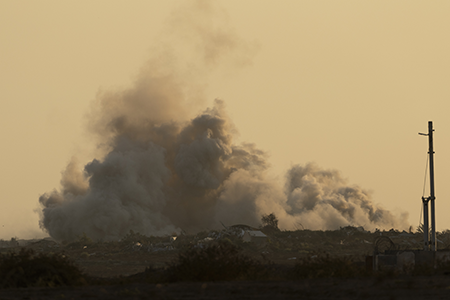 Smoke rises over the Gaza Strip after an Israeli bombardment on July 23. Hamas attacked Israel on Oct. 7, 2023, prompting Israel’s invasion of Gaza. (Photo by Amir Levy/Getty Images)