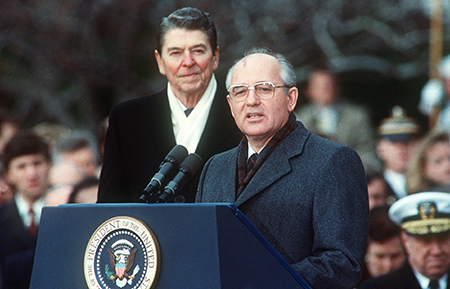 U.S. President Ronald Reagan (L) and Soviet leader Mikhail Gorbachev at the start of a White House summit in December 1987 when they signed the Intermediate-Range Nuclear Forces Treaty in an attempt to reverse the nuclear arms race.  (Photo by Jerome Delay/AFP via Getty Images)