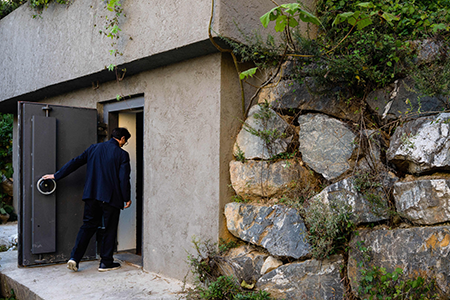 A man in Jecheon, South Korea, enters the underground bunker he built to protect against a potential North Korean nuclear attack. Experts are concerned that Saudi Arabia, South Korea, and Turkey could someday become the next nuclear-weapon states. (Photo by Anthony Wallace / AFP via Getty Images)