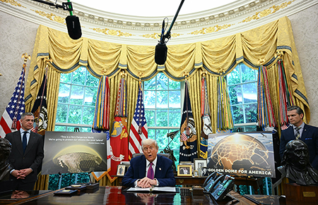 U.S. President Donald Trump speaks as U.S. Secretary of Defense Pete Hegseth (R) looks on during an announcement about the Golden Dome missile defense shield, in the Oval Office of the White House on May 20, 2025, in Washington, D.C.  (Photo by Jim Watson/AFP via Getty Images)